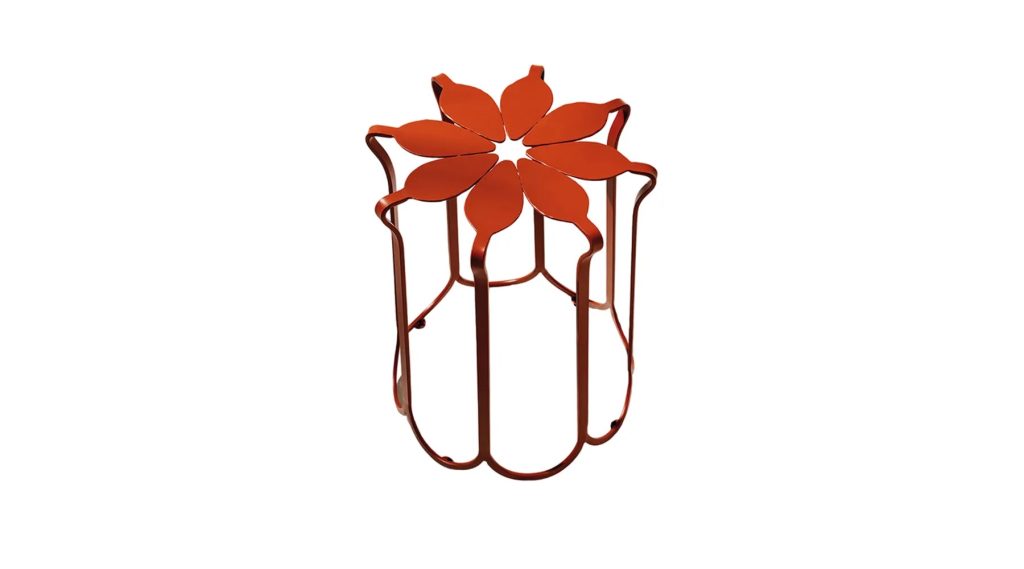 A decorative metal stand with a red flower-shaped top and wavy vertical supports, isolated on a white background.